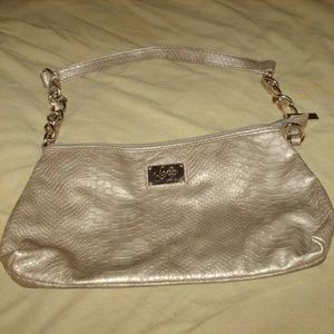 Sofia Vergara snakeskin print purse handbag